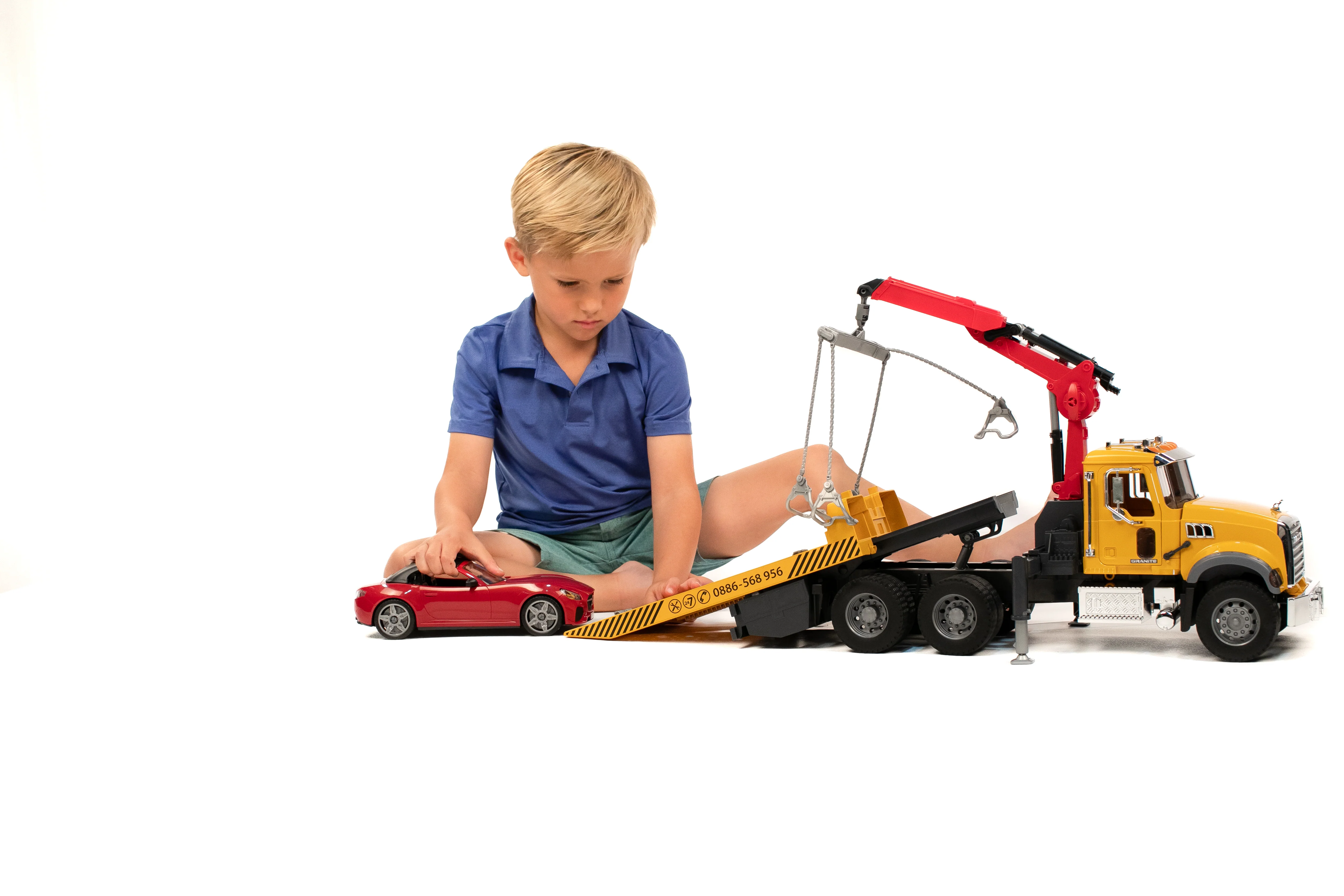Bruder 02829 Mack Granite Tow Truck with Roadster 28.12.10 - Image 6